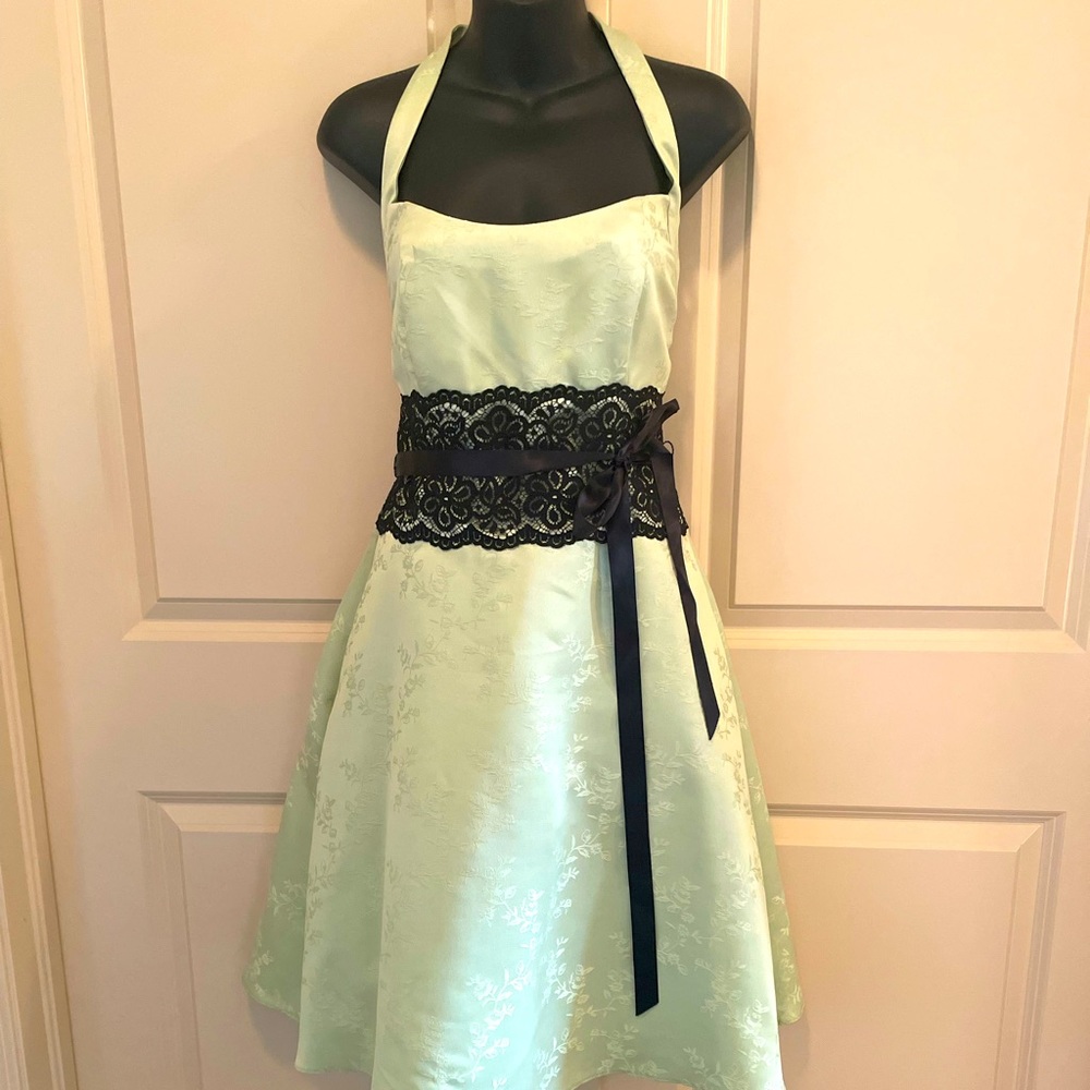 Mid length green and black vintage style dress